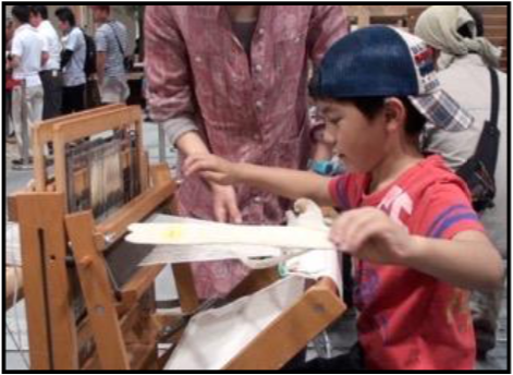 Eager young helpers weave shavings
